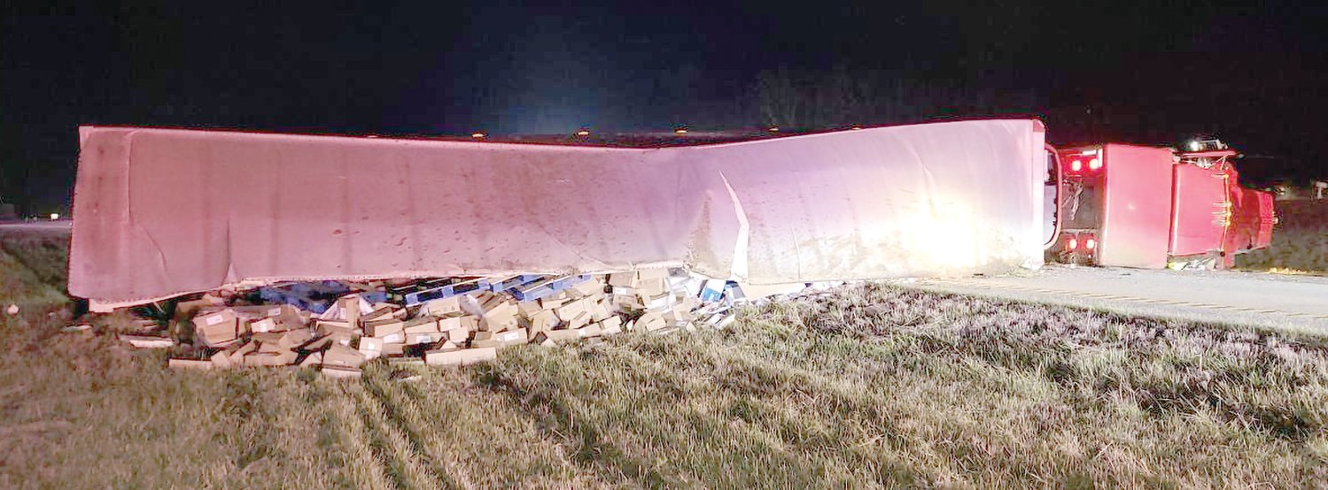 A semi full of turkey deli meat lays across Highway 60 during an accident last week.